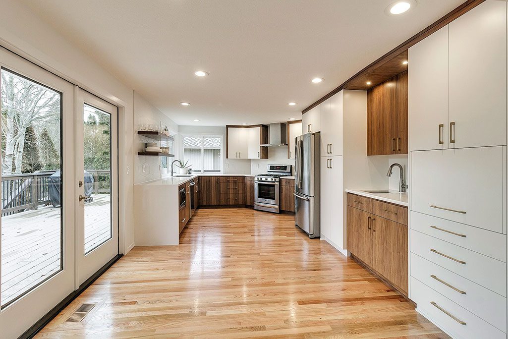 Open Concept Kitchen Remodel with Two Toned Cabinets and Matching Appliance Finishes